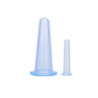 Two blue Silicone facial cups, one large, one small on a white background