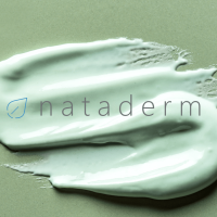 The Nataderm Logo on a blob of alginate jelly peel off mask on a green background