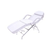 A basic esthetics table with removable arm rests, adjustable foot and back support